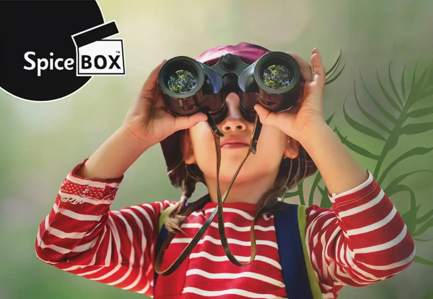 A young child holding a pair of binoculars.