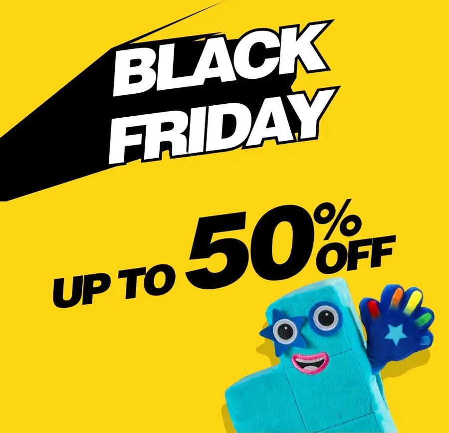 Blue plush monster toy with colorful hands and star on its chest, holding a sign.