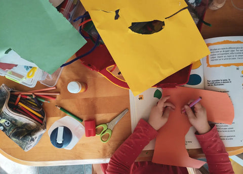 Chils Playing with Colourful Arts and Crafts Supplies